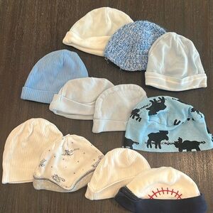 11 newborn/baby hats. Blues and whites. Most are 5-8 lbs.